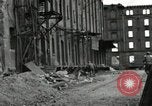 Image of U.S. Army patrol moves carefully through ruins of German City Ludwigshafen Germany, 1945, second 58 stock footage video 65675074328