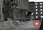 Image of U.S. Army patrol moves carefully through ruins of German City Ludwigshafen Germany, 1945, second 59 stock footage video 65675074328