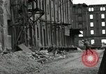Image of U.S. Army patrol moves carefully through ruins of German City Ludwigshafen Germany, 1945, second 61 stock footage video 65675074328