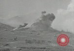 Image of explosions on hill Okinawa Ryukyu Islands, 1945, second 9 stock footage video 65675074417