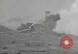 Image of explosions on hill Okinawa Ryukyu Islands, 1945, second 10 stock footage video 65675074417