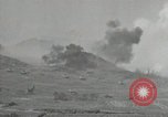 Image of explosions on hill Okinawa Ryukyu Islands, 1945, second 11 stock footage video 65675074417
