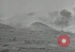 Image of explosions on hill Okinawa Ryukyu Islands, 1945, second 18 stock footage video 65675074417