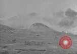 Image of explosions on hill Okinawa Ryukyu Islands, 1945, second 19 stock footage video 65675074417