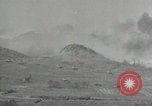 Image of explosions on hill Okinawa Ryukyu Islands, 1945, second 20 stock footage video 65675074417