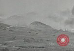 Image of explosions on hill Okinawa Ryukyu Islands, 1945, second 21 stock footage video 65675074417