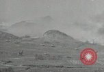 Image of explosions on hill Okinawa Ryukyu Islands, 1945, second 22 stock footage video 65675074417