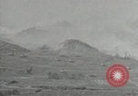 Image of explosions on hill Okinawa Ryukyu Islands, 1945, second 23 stock footage video 65675074417