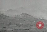 Image of explosions on hill Okinawa Ryukyu Islands, 1945, second 24 stock footage video 65675074417
