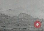 Image of explosions on hill Okinawa Ryukyu Islands, 1945, second 25 stock footage video 65675074417