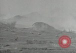 Image of explosions on hill Okinawa Ryukyu Islands, 1945, second 26 stock footage video 65675074417