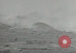 Image of explosions on hill Okinawa Ryukyu Islands, 1945, second 27 stock footage video 65675074417