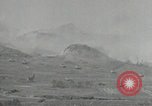 Image of explosions on hill Okinawa Ryukyu Islands, 1945, second 28 stock footage video 65675074417