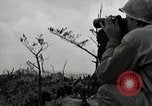 Image of explosions on hill Okinawa Ryukyu Islands, 1945, second 31 stock footage video 65675074417