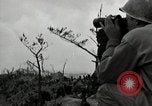 Image of explosions on hill Okinawa Ryukyu Islands, 1945, second 32 stock footage video 65675074417