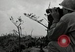 Image of explosions on hill Okinawa Ryukyu Islands, 1945, second 33 stock footage video 65675074417