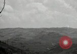 Image of explosions on hill Okinawa Ryukyu Islands, 1945, second 40 stock footage video 65675074417