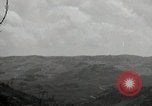 Image of explosions on hill Okinawa Ryukyu Islands, 1945, second 44 stock footage video 65675074417