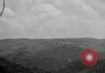 Image of explosions on hill Okinawa Ryukyu Islands, 1945, second 45 stock footage video 65675074417