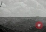 Image of explosions on hill Okinawa Ryukyu Islands, 1945, second 46 stock footage video 65675074417