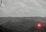 Image of explosions on hill Okinawa Ryukyu Islands, 1945, second 48 stock footage video 65675074417