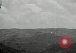 Image of explosions on hill Okinawa Ryukyu Islands, 1945, second 50 stock footage video 65675074417