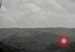 Image of explosions on hill Okinawa Ryukyu Islands, 1945, second 51 stock footage video 65675074417