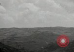 Image of explosions on hill Okinawa Ryukyu Islands, 1945, second 52 stock footage video 65675074417