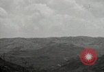 Image of explosions on hill Okinawa Ryukyu Islands, 1945, second 53 stock footage video 65675074417