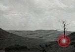 Image of explosions on hill Okinawa Ryukyu Islands, 1945, second 54 stock footage video 65675074417
