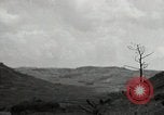 Image of explosions on hill Okinawa Ryukyu Islands, 1945, second 55 stock footage video 65675074417