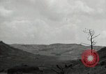 Image of explosions on hill Okinawa Ryukyu Islands, 1945, second 57 stock footage video 65675074417
