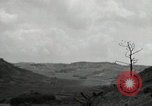Image of explosions on hill Okinawa Ryukyu Islands, 1945, second 58 stock footage video 65675074417