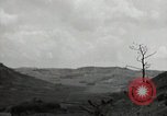 Image of explosions on hill Okinawa Ryukyu Islands, 1945, second 59 stock footage video 65675074417