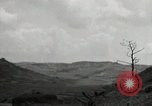 Image of explosions on hill Okinawa Ryukyu Islands, 1945, second 61 stock footage video 65675074417