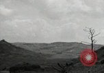 Image of explosions on hill Okinawa Ryukyu Islands, 1945, second 62 stock footage video 65675074417