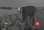 Image of U.S. sailor filling fuel tank prior to D-Day in World War II Portland England United Kingdom, 1944, second 5 stock footage video 65675074622