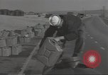 Image of U.S. sailor filling fuel tank prior to D-Day in World War II Portland England United Kingdom, 1944, second 10 stock footage video 65675074622
