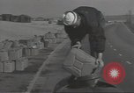 Image of U.S. sailor filling fuel tank prior to D-Day in World War II Portland England United Kingdom, 1944, second 12 stock footage video 65675074622