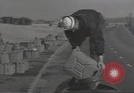 Image of U.S. sailor filling fuel tank prior to D-Day in World War II Portland England United Kingdom, 1944, second 13 stock footage video 65675074622