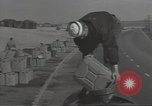 Image of U.S. sailor filling fuel tank prior to D-Day in World War II Portland England United Kingdom, 1944, second 14 stock footage video 65675074622