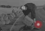 Image of U.S. sailor filling fuel tank prior to D-Day in World War II Portland England United Kingdom, 1944, second 19 stock footage video 65675074622