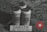 Image of U.S. sailor filling fuel tank prior to D-Day in World War II Portland England United Kingdom, 1944, second 31 stock footage video 65675074622