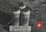 Image of U.S. sailor filling fuel tank prior to D-Day in World War II Portland England United Kingdom, 1944, second 32 stock footage video 65675074622