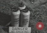 Image of U.S. sailor filling fuel tank prior to D-Day in World War II Portland England United Kingdom, 1944, second 35 stock footage video 65675074622