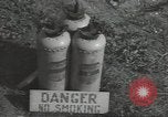 Image of U.S. sailor filling fuel tank prior to D-Day in World War II Portland England United Kingdom, 1944, second 36 stock footage video 65675074622
