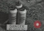 Image of U.S. sailor filling fuel tank prior to D-Day in World War II Portland England United Kingdom, 1944, second 39 stock footage video 65675074622