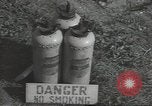 Image of U.S. sailor filling fuel tank prior to D-Day in World War II Portland England United Kingdom, 1944, second 41 stock footage video 65675074622