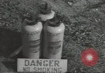 Image of U.S. sailor filling fuel tank prior to D-Day in World War II Portland England United Kingdom, 1944, second 42 stock footage video 65675074622