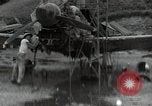 Image of USAAC mechanics perform maintenance on P-40 and P-400 airplanes Guadalcanal Solomon Islands, 1943, second 1 stock footage video 65675074690
